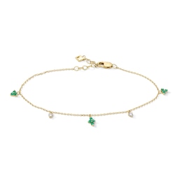 1/20 CT. T.W. Diamond and Emerald Quartet Dangle Station Bracelet in 10K Gold - 7"