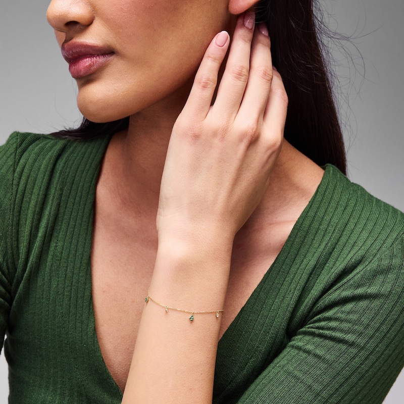 Main Image 2 of 1/20 CT. T.W. Diamond and Emerald Quartet Dangle Station Bracelet in 10K Gold - 7"