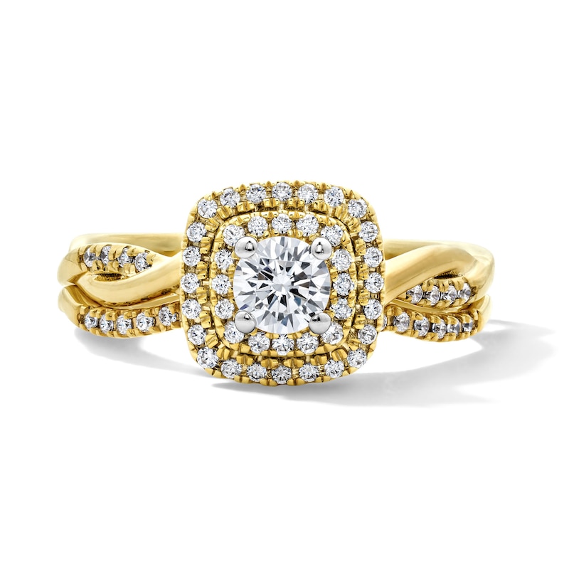 Main Image 1 of 5/8 CT. T.W. Round Lab-Grown Diamond Cushion Frame Twist Shank Bridal Set in 14K Yellow Gold (F/VS2)