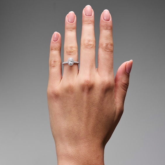 Grand Firework 1-1/2 CT. T.w. Oval Certified Lab-Grown Diamond Frame Engagement Ring in 14K White Gold (F/Vs2)