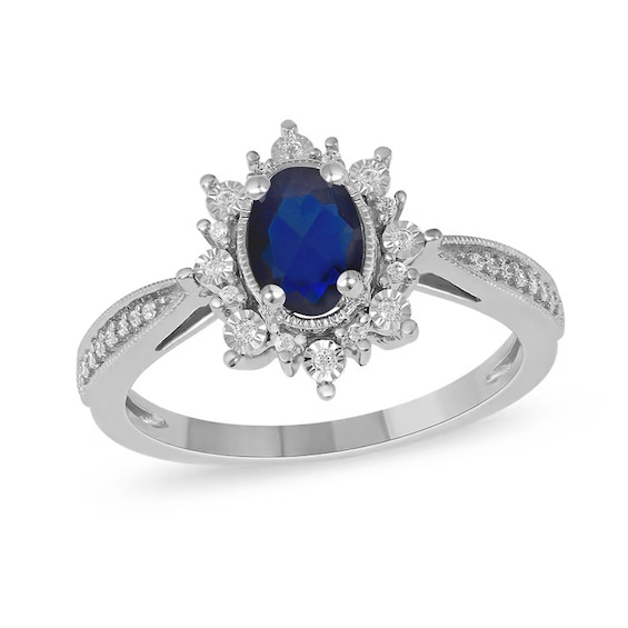 Oval Blue Sapphire and 1/10 CT. T.w. Diamond Starburst Frame Ring in 10K White Gold