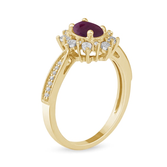 Oval Ruby and 1/10 CT. T.w. Diamond Starburst Frame Ring in 10K Gold