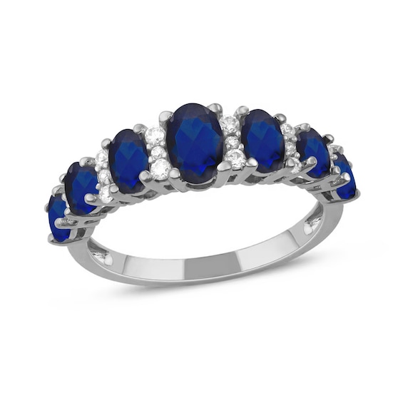 Oval Blue Sapphire and 1/6 CT. T.w. Diamond Graduated Ring in 10K White Gold
