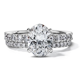 3 CT. T.W. Certified Oval Lab-Grown Diamond Hidden Frame Bridal Set in 14K White Gold (F/VS2)