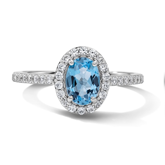 Oval Swiss Blue Topaz and White Lab-Created Sapphire Frame Ring in Sterling Silver