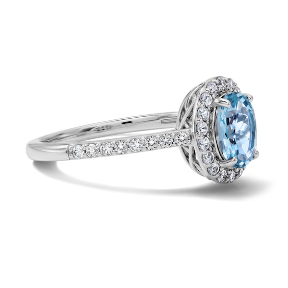 Oval Swiss Blue Topaz and White Lab-Created Sapphire Frame Ring in Sterling Silver