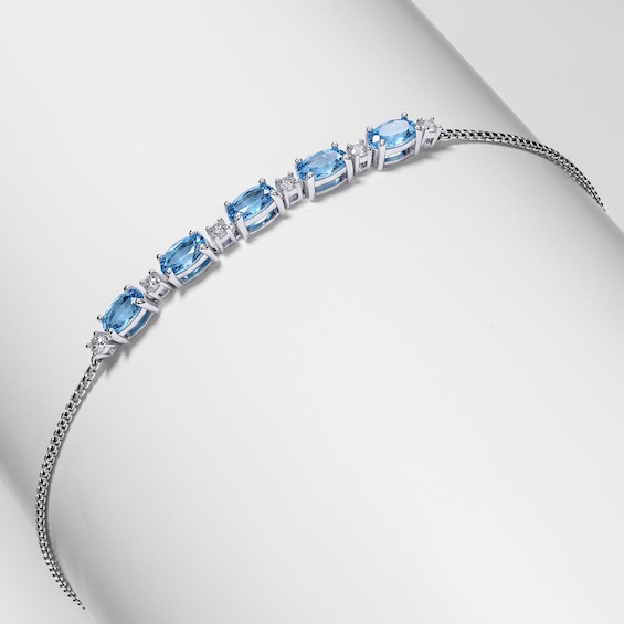Oval Swiss Blue Topaz and White Lab-Created Sapphire Adjustable Bracelet in Sterling Silver - 9"