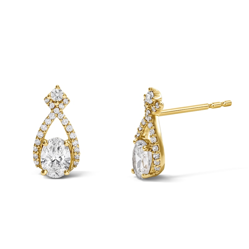 Main Image 1 of 1/2 CT. T.W. Oval Lab-Grown Diamond Crisscross Teardrop Frame Stud Earrings in 10K Gold (F/VS2)