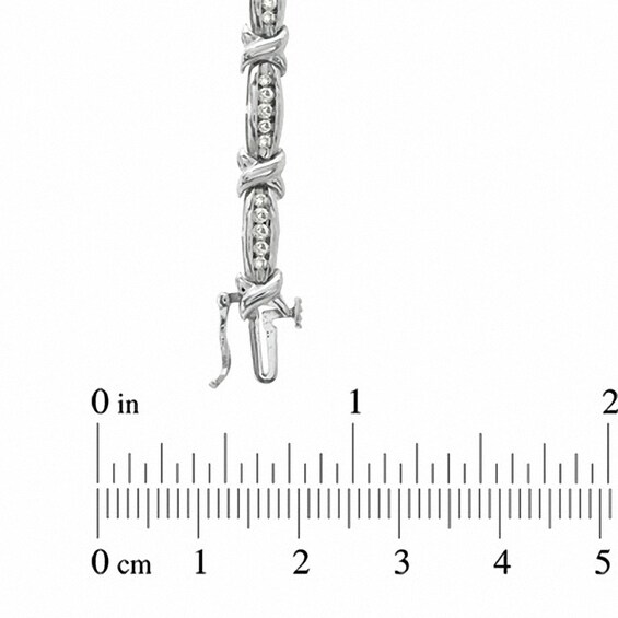 Previously Owned - 1 CT. T.w. Diamond Channel "X" Link Bracelet in 10K White Gold