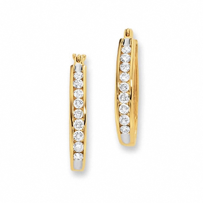 Previously Owned - 1/4 CT. T.W. Channel-Set Diamond Oval Hoop Earrings in 14K Gold