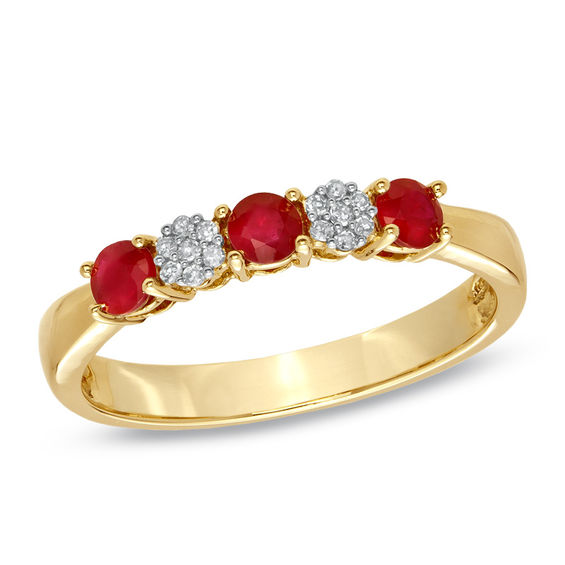 Previously Owned - Ruby and 1/20 CT. T.w. Diamond Three Stone Ring in 10K Gold