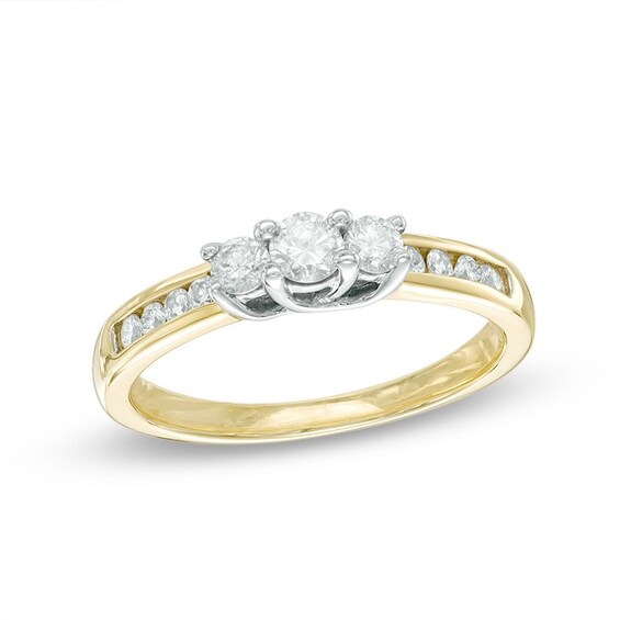 Previously Owned - 1/2 CT. T.w. Diamond Past Present Future® Ring in 10K Gold