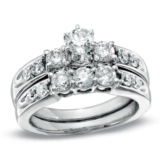 Previously Owned 1-1/2 CT. T.w. Diamond Three Stone Soldered Bridal Set in 14K White Gold