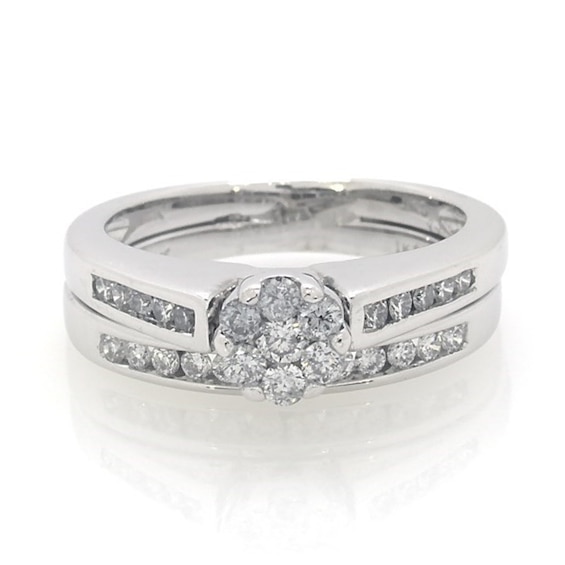 Previously Owned 1/2 CT. T.w. Diamond Flower Soldered Bridal Set in 10K White Gold