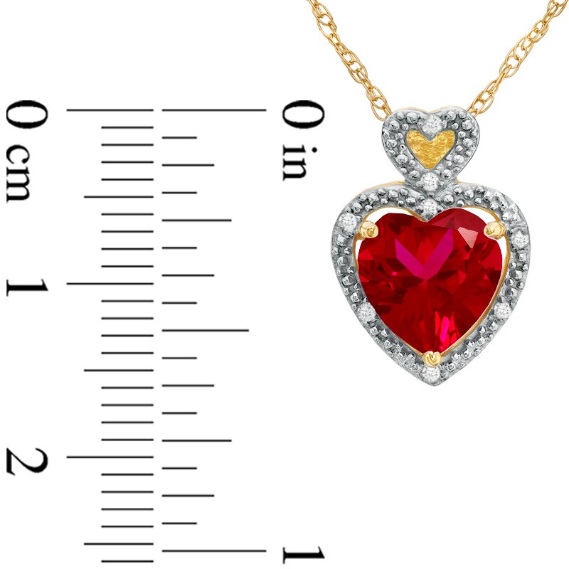 Main Image 2 of Previously Owned - 8.0mm Heart-Shaped Lab-Created Ruby and Diamond Accent Heart Frame Pendant in 10K Gold