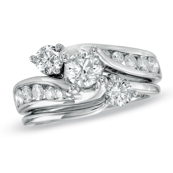 Previously Owned 1-1/2 CT. T.w. Diamond Three Stone Soldered Bridal Set in 14K White Gold