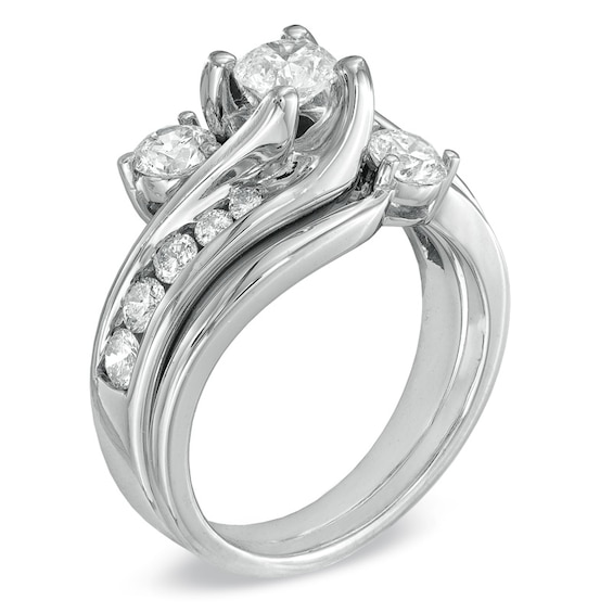 Previously Owned 1-1/2 CT. T.w. Diamond Three Stone Soldered Bridal Set in 14K White Gold