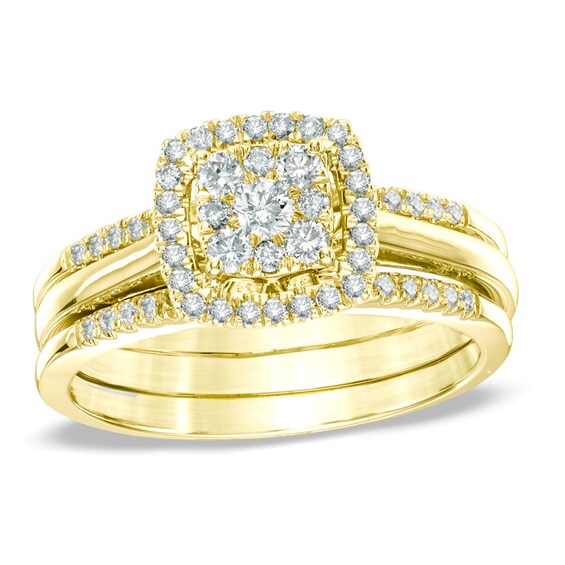 Previously Owned - 1/2 CT. T.w. Diamond Cluster Frame Three Piece Bridal Set in 10K Gold