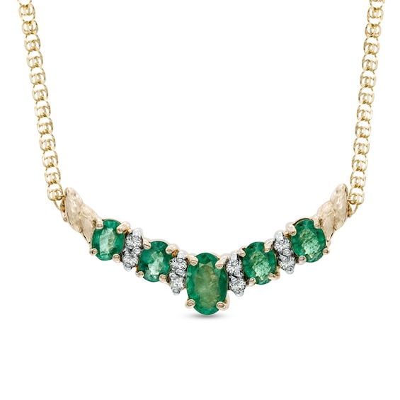 Previously Owned - Oval Emerald and 1/8 CT. T.w. Diamond Necklace in 14K Gold - 16"