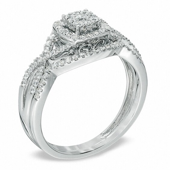 Previously Owned - 1/2 CT. T.w. Diamond Cluster Twist Shank Bridal Set in 10K White Gold