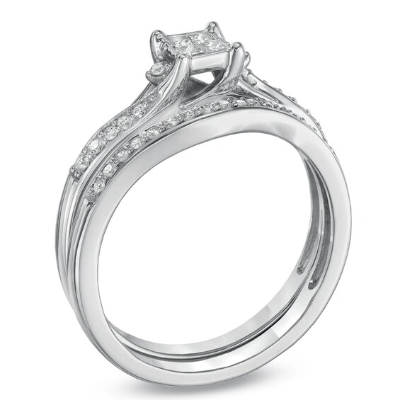 Previously Owned - 1/4 CT. T.w. Quad Princess-Cut Diamond Bypass Bridal Set in 10K White Gold