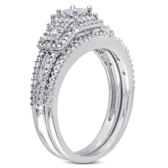 Previously Owned - 1/4 CT. T.w. Quad Princess-Cut Diamond Frame Bridal Set in Sterling Silver