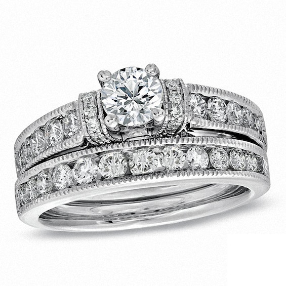 Previously Owned - Celebration Ideal 1-1/2 CT. T.w. Diamond Bridal Set in 14K White Gold (J/I1)