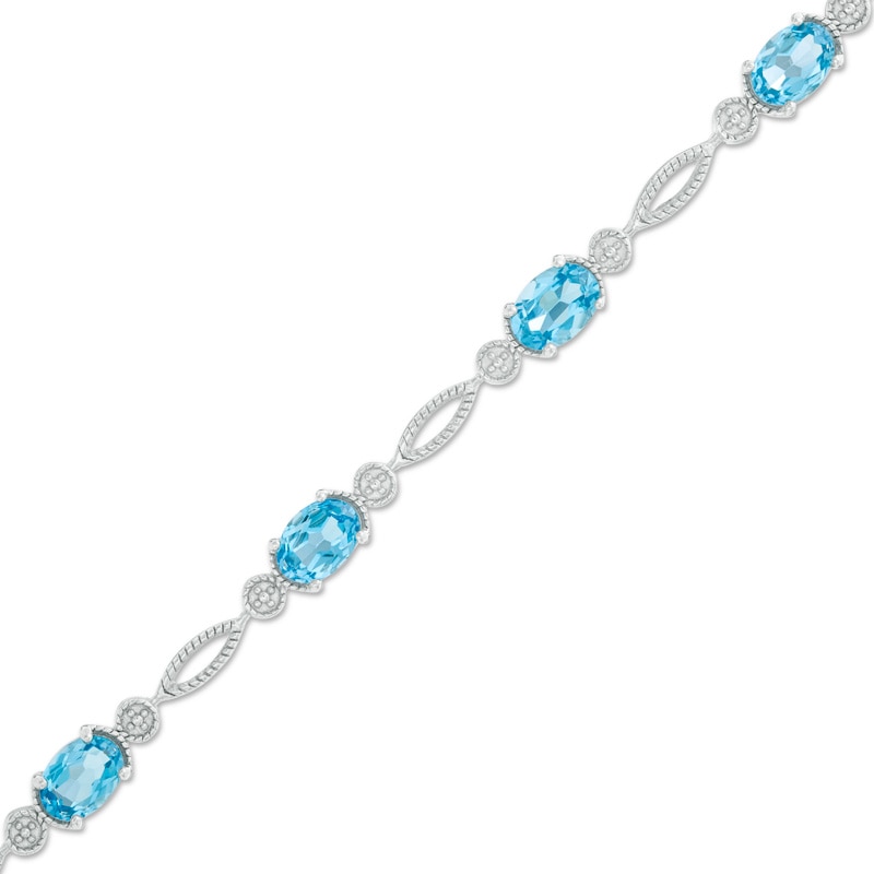 Previously Owned - Oval Swiss Blue Topaz Rope Bracelet in Sterling Silver - 7.5"