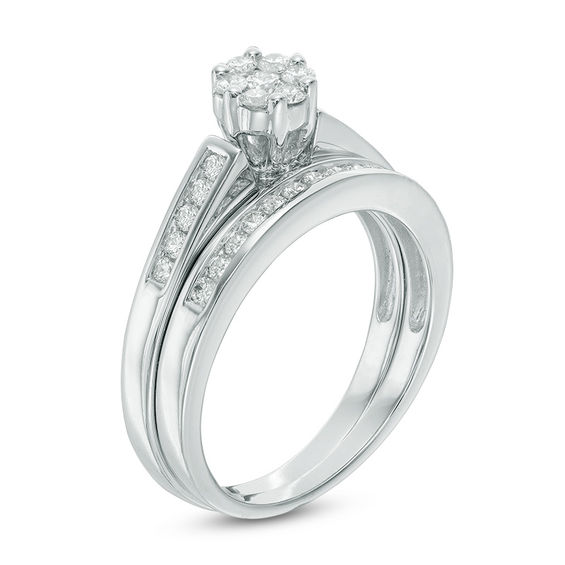 Previously Owned - 1/2 CT. T.w. Multi-Diamond Flower Bridal Set in 10K White Gold