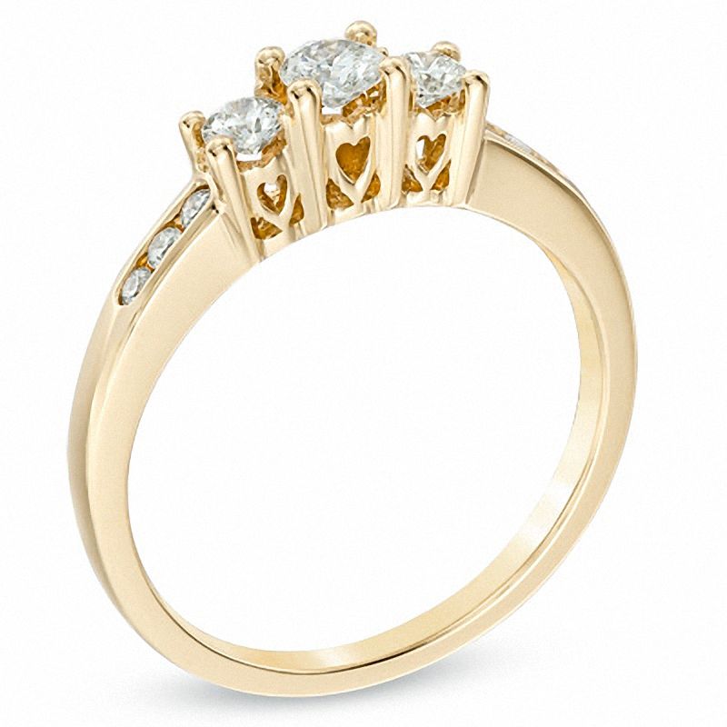 Previously Owned - 1/2 CT. T.W. Diamond Past Present Future® Ring in 14K Gold