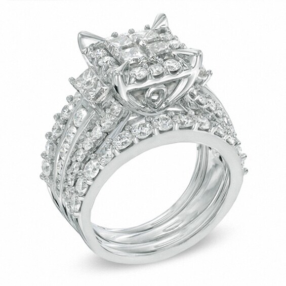 Previously Owned - 4 CT. T.w. Quad Princess-Cut Diamond Frame Three Piece Bridal Set in 14K White Gold