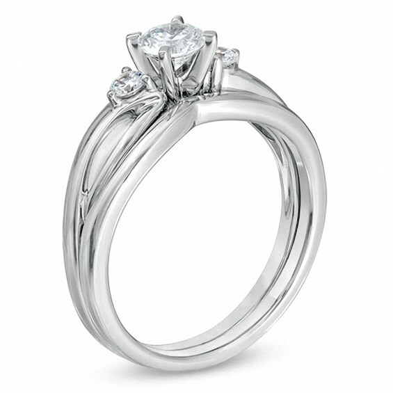 Previously Owned - 1/2 CT. T.w. Diamond Three Stone Split Shank Bridal Set in 14K White Gold (I/Si2)