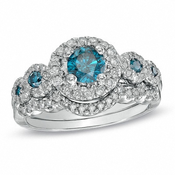 Previously Owned - 1-1/8 CT. T.w. Enhanced Blue and White Diamond Five Stone Frame Bridal Set in 14K White Gold