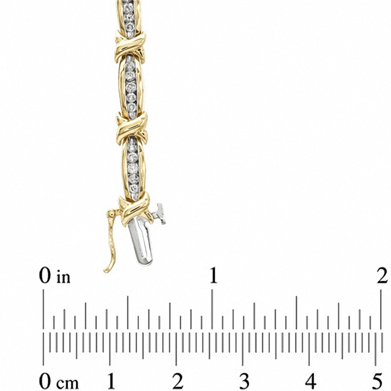 Previously Owned - 1 CT. T.W. Diamond Fashion "X" Bracelet in 10K Gold