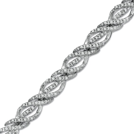 Previously Owned - 1/2 CT. T.w. Diamond Ribbon Twist Bracelet in Sterling Silver