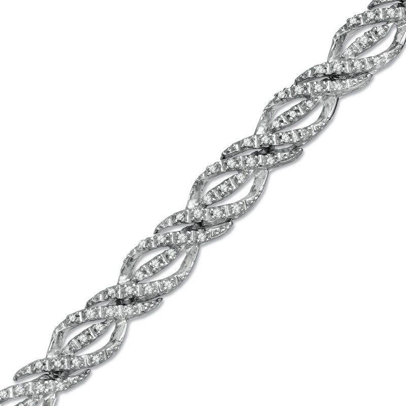 Main Image 1 of Previously Owned - 1/2 CT. T.W. Diamond Ribbon Twist Bracelet in Sterling Silver