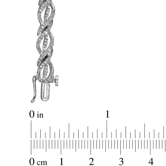 Previously Owned - 1/2 CT. T.w. Diamond Ribbon Twist Bracelet in Sterling Silver