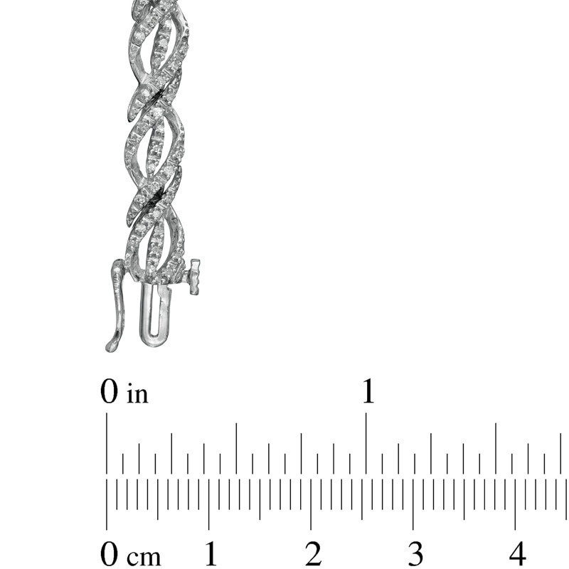 Main Image 2 of Previously Owned - 1/2 CT. T.W. Diamond Ribbon Twist Bracelet in Sterling Silver