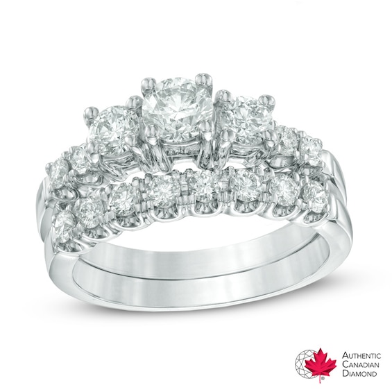 Previously Owned - 1-1/4 CT. T.w. Diamond Three Stone Bridal Set in 14K White Gold (I/I1)