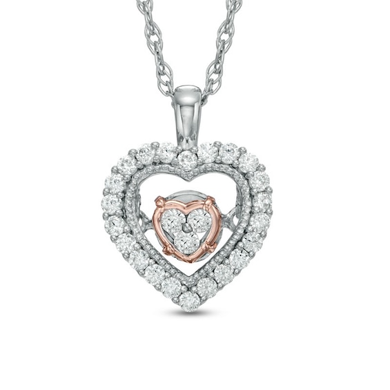 Previously Owned - 1/6 CT. T.w. Diamond Heart Pendant in 10K Two-Tone Gold