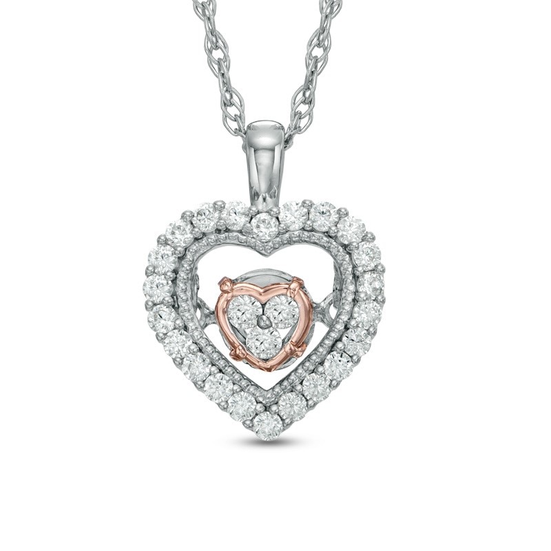 Previously Owned - 1/6 CT. T.W. Diamond Heart Pendant in 10K Two-Tone Gold