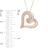 Thumbnail Image 1 of Previously Owned - 1/4 CT. T.W. Baguette and Round Diamond Tilted Heart Pendant in 10K Rose Gold