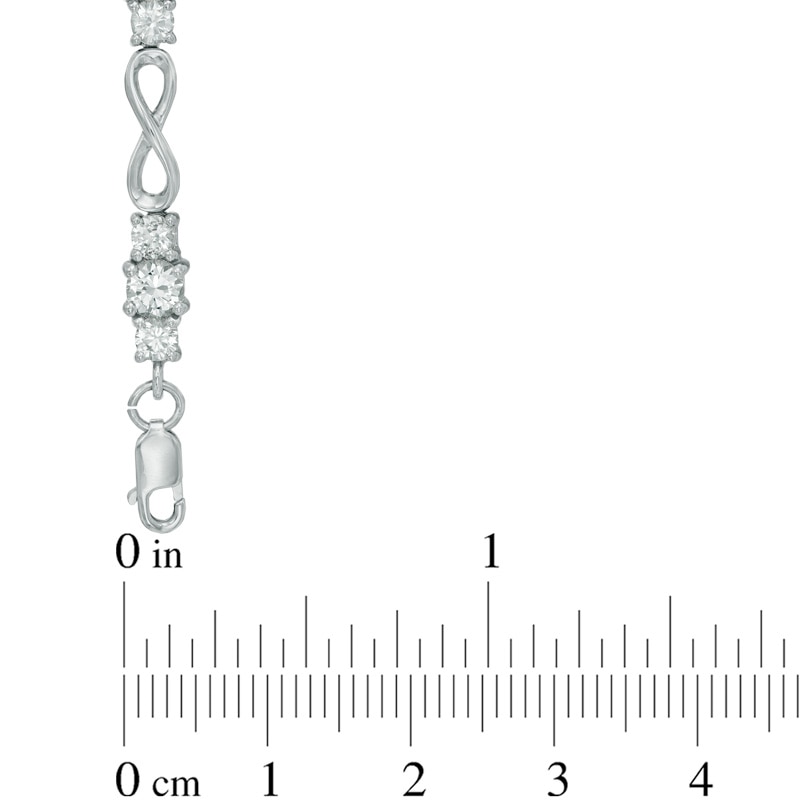 Previously Owned - Lab-Created White Sapphire Infinity Link Three Stone Bracelet in Sterling Silver - 7.25"