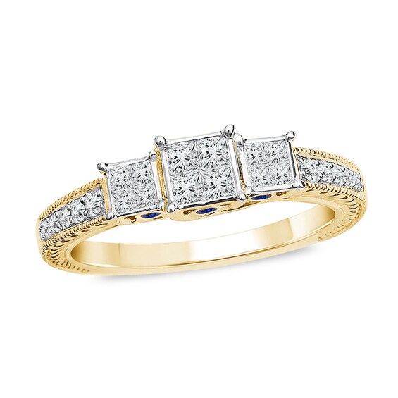 Previously Owned - 1/2 CT. T.w. Enhanced Blue and White Quad Princess-Cut Diamond Three Stone Ring in 10K Gold