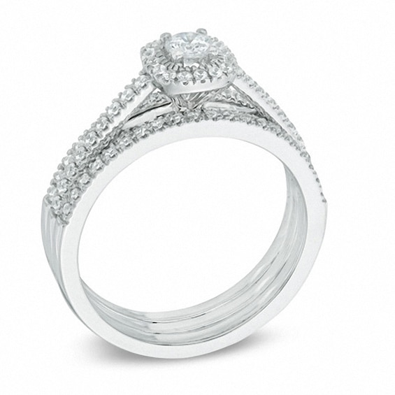 Previously Owned - 1/2 CT. T.w. Diamond Frame Three Piece Bridal Set in 14K White Gold