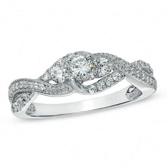 Previously Owned - 5/8 CT. T.w. Diamond Three Stone Twist Ring in 10K White Gold