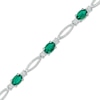 Thumbnail Image 1 of Previously Owned - Oval Lab-Created Emerald and Diamond Accent Bracelet in Sterling Silver - 7.25"