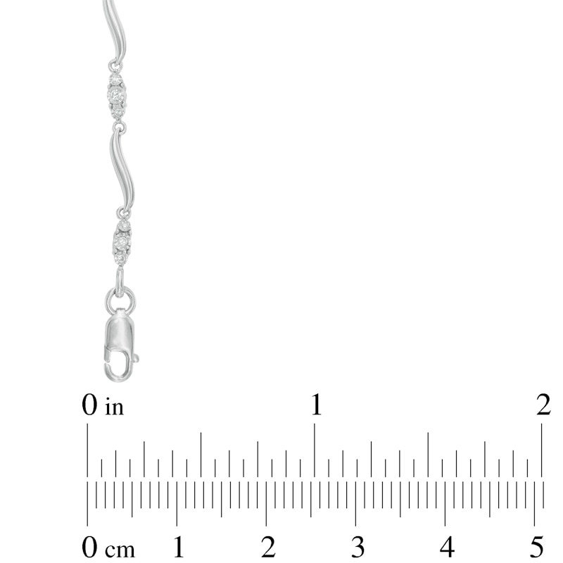 Main Image 2 of Previously Owned - 1/8 CT. T.W. Diamond Three Stone Curved Station Bracelet in 10K White Gold