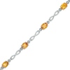 Thumbnail Image 0 of Previously Owned - Oval Madeira Citrine Infinity Link Bracelet in Sterling Silver - 7.25"