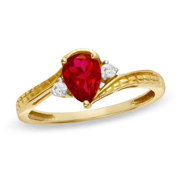 Previously Owned - Pear-Shaped Lab-Created Ruby and Diamond Accent Bypass Ring in 10K Gold
